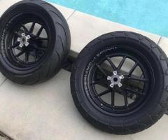 A pair of dyna fat bobs FXFB softail wheels with tires