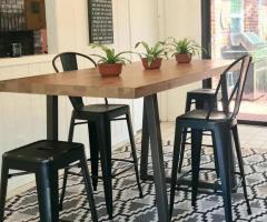 "Elevated Dining: The Versatility of Bar Height Communal Tables"